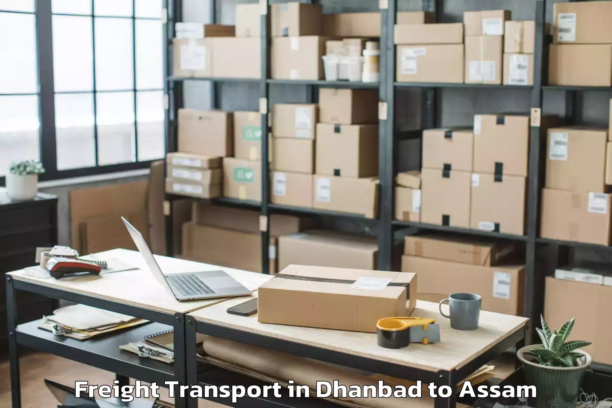 Quality Dhanbad to Pachim Nalbari Freight Transport